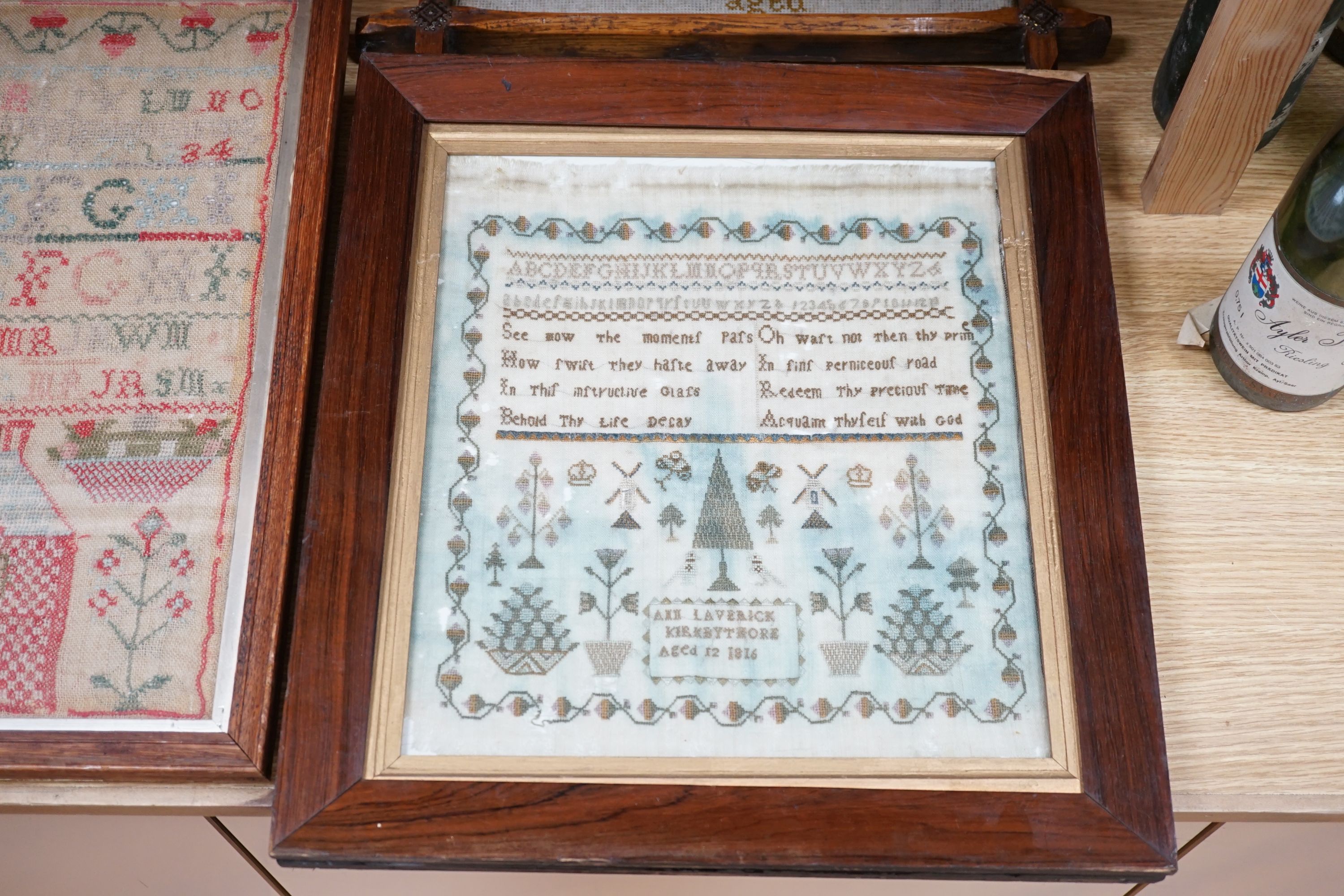 Four 19th century samplers, in glazed wood frames, largest 42cm high